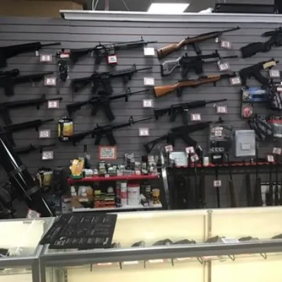 Professional gun store interior showing proper firearm display for listing
